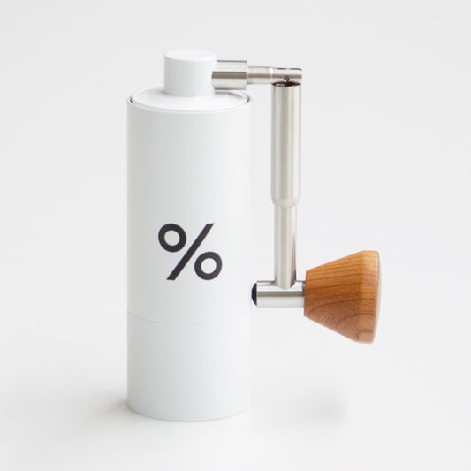 % ARABICA Travel Grinder. Aluminum Alloy, Stainless Steel, Natural Wood with carry bag. Compact and grinds up to 15 grams.